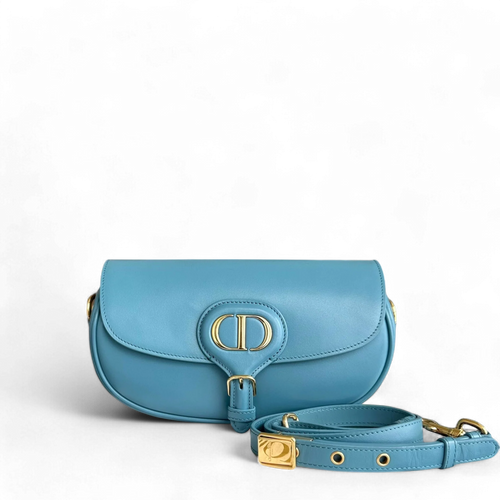 Kovancy Bobby East West - Sac bandoulière en cuir de veau lisse, accastillage bleu doré