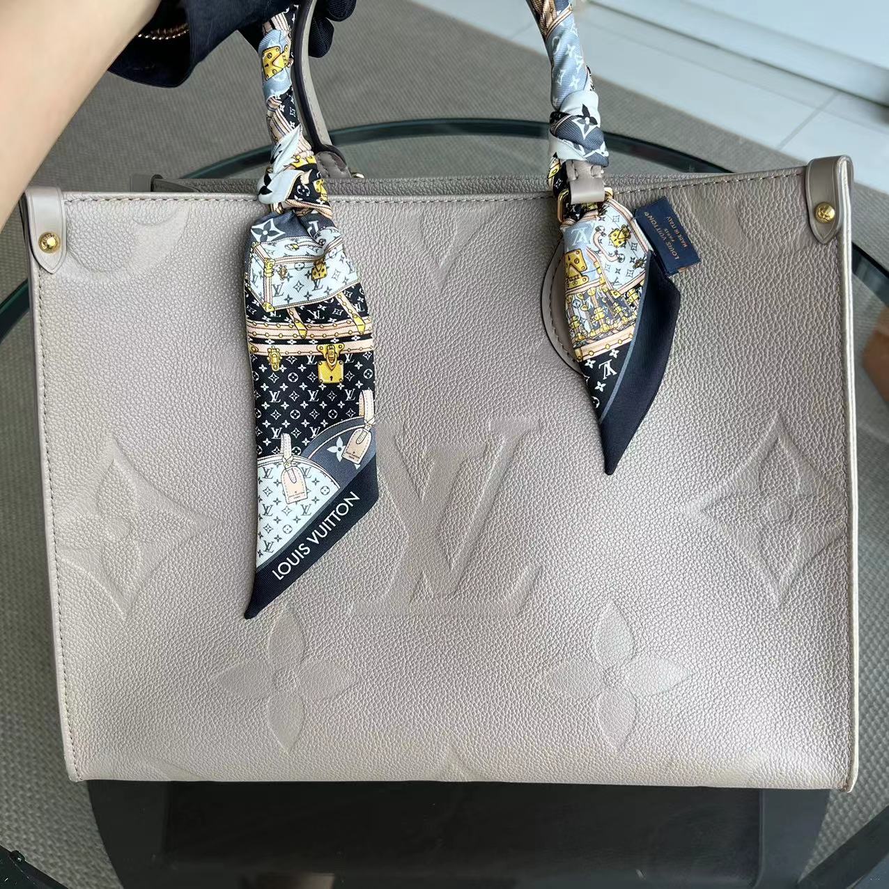Kovancy OnTheGo MM On The Go Monogram Empreinte Tourterelle Gris